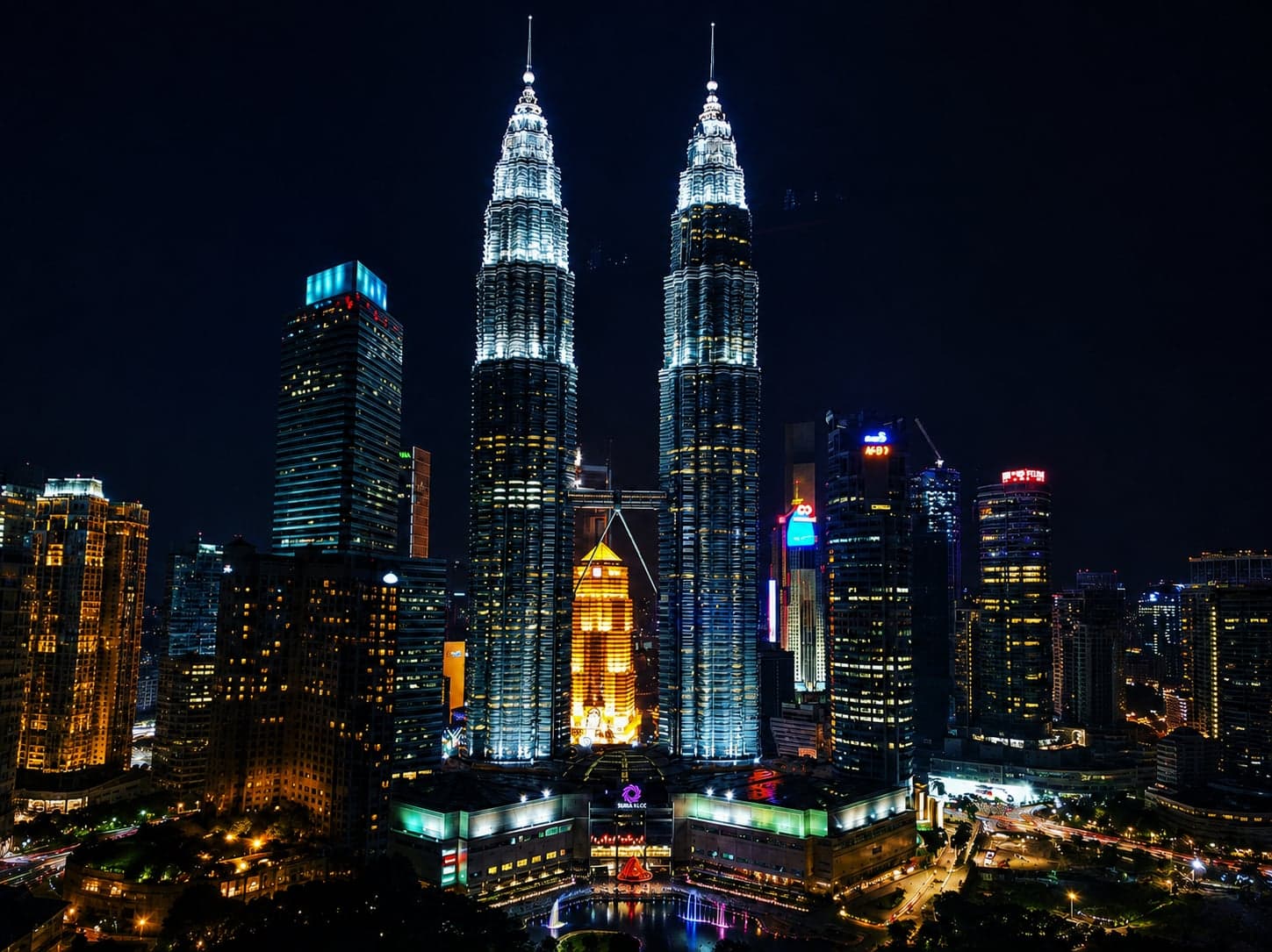 The Petronas Twin Towers lit up at night in Kuala Lumpur